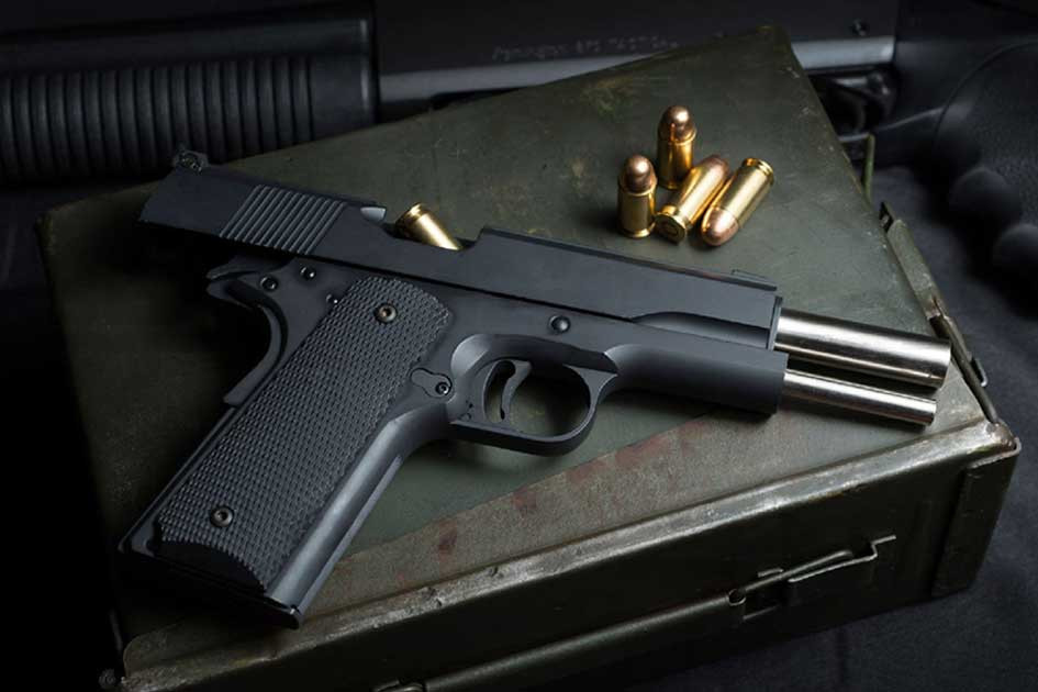 Unloaded, open handgun with a loaded clip