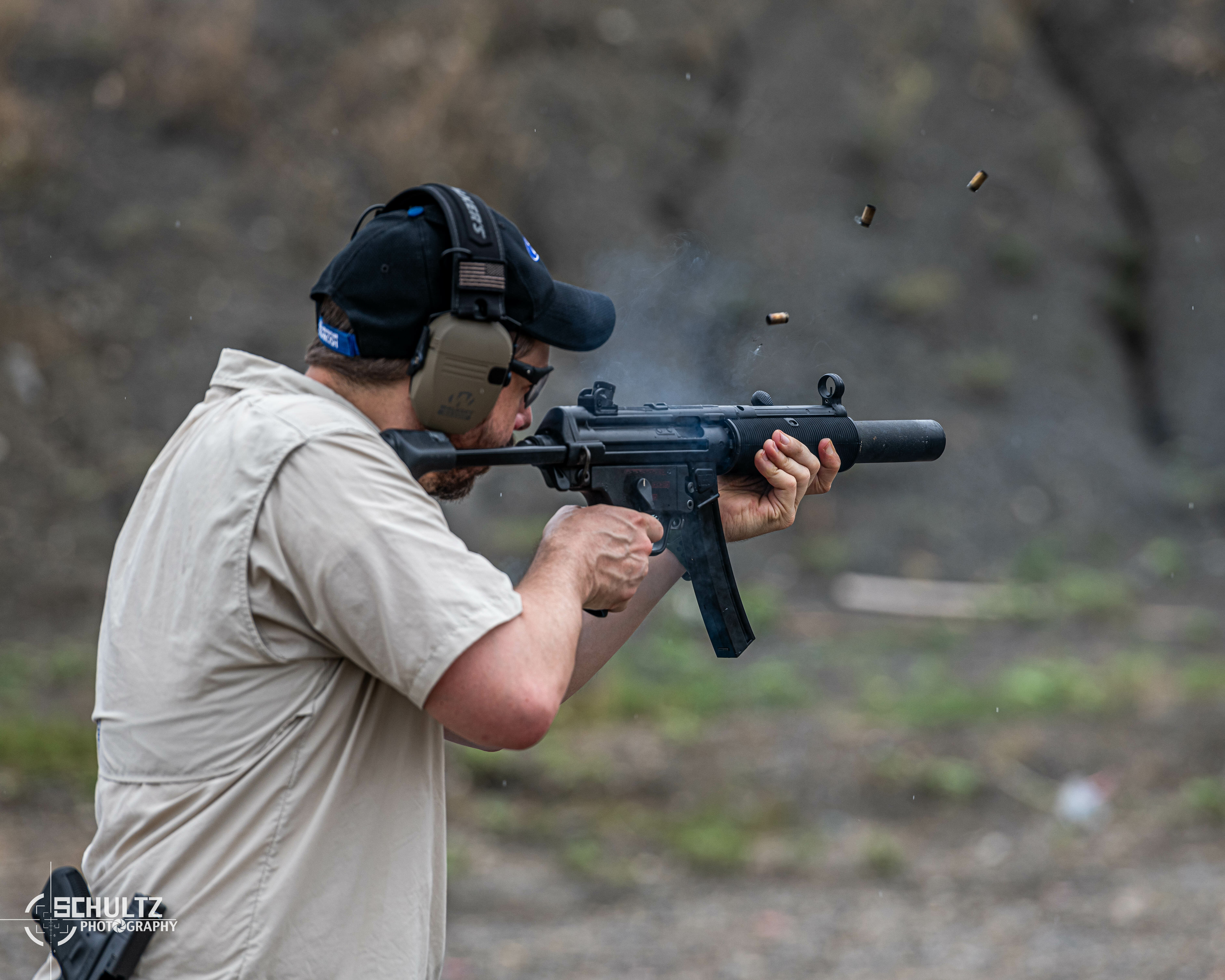 Individual firing a gun