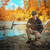 ORX Metal Detector with HF Elliptical Coil (9.5x5) lifestyle photo man kneeling by a river holding a metal detector 