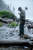 Vanquish 560 Pro-Pack lifestyle photo. Man in the river metal detecting with scoop on his shoulder