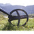 XP 9" Search Coil in Grass with Mountains Faded in Background