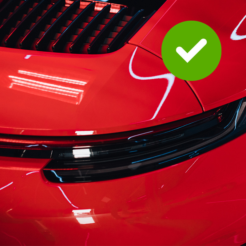 Red vehicle paint representing a color-match claim covered by the TouchUpDirect guarantee.