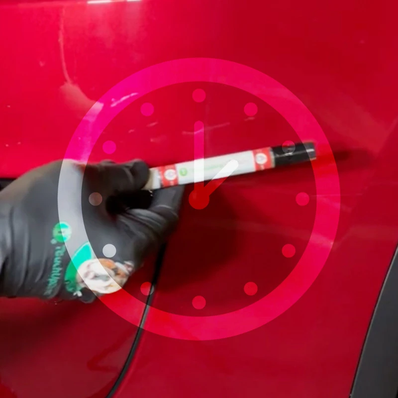 Black-gloved hand applying clearcoat to a red vehicle panel with a clock graphic showing drying time.