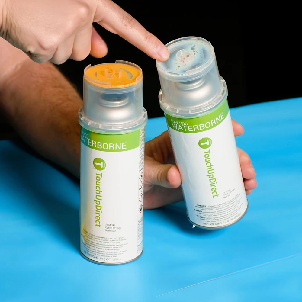 TouchUpDirect basecoat and midcoat bottles beside a mixing cup for a tricoat finish.
