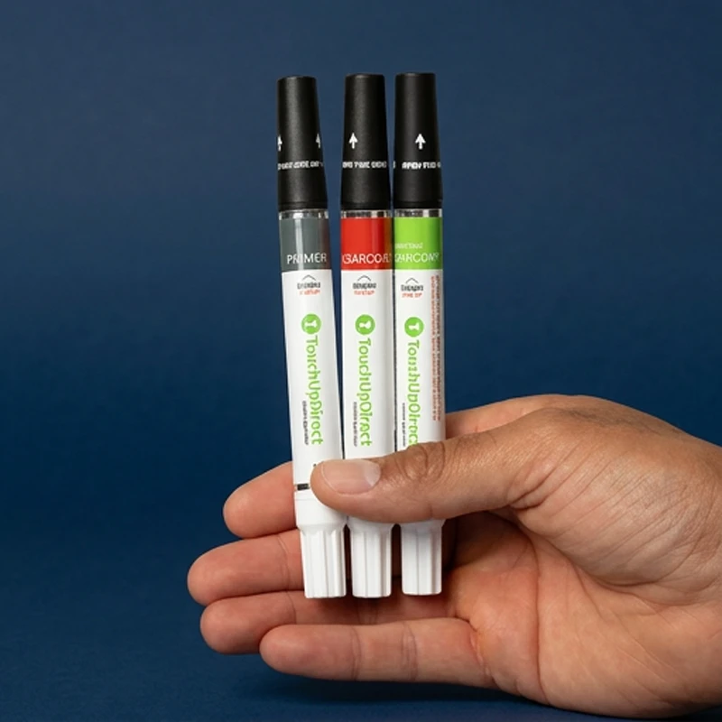 Hand holding four touch up combo applicators