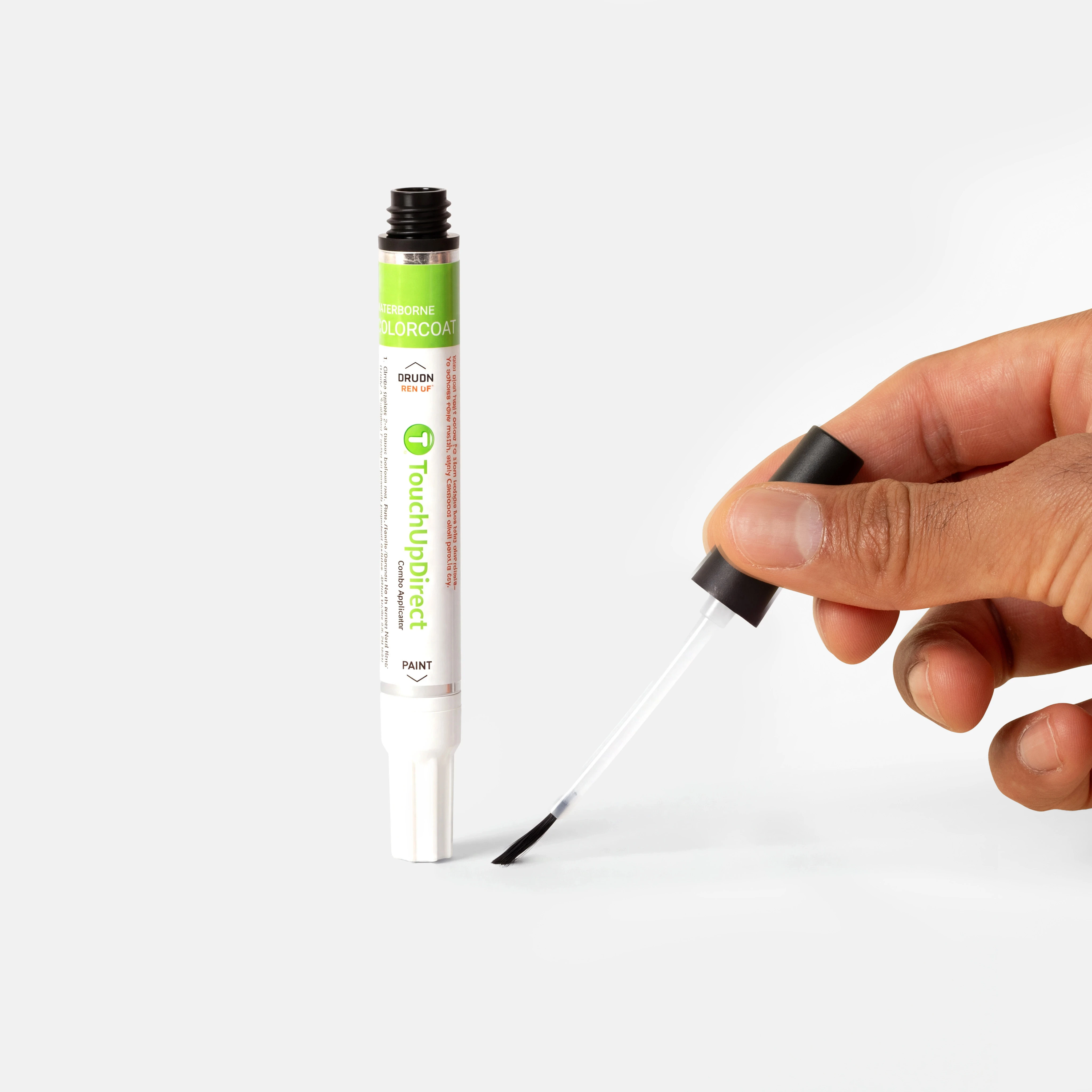 Touch up combo applicator shown upright with the brush tip applying paint