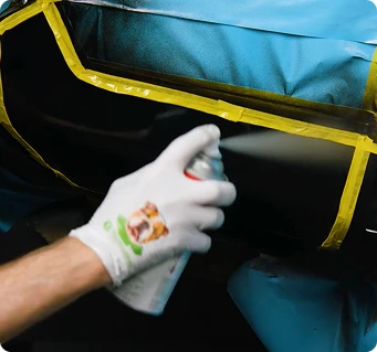 Applying aerosol clearcoat over a painted vehicle panel