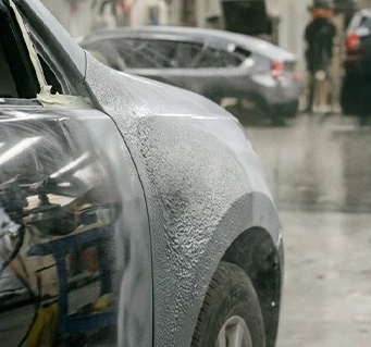 Vehicle panel with a thick and uneven coat of automotive primer