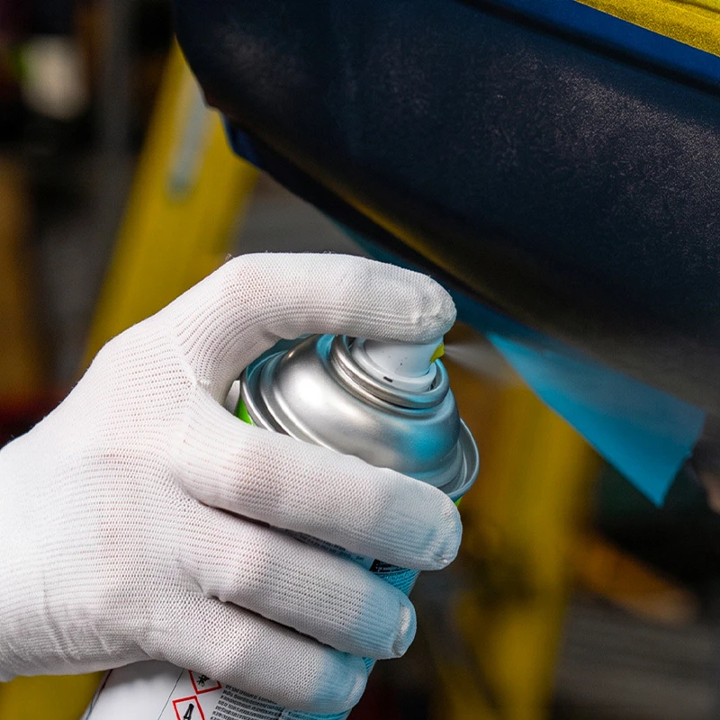 Applying aerosol colorcoat to a masked vehicle repair area