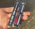 LRI-FH12 - Enamel Metal Dashboard Heater & Fan Control Slider Emblems Badge - Land Rover Defender TDi - by Lucari