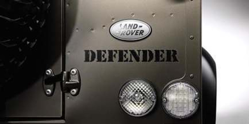 LR024182 - Genuine Land Rover Defender Tailgate Badge - As Fitted to Defender RAW Special Edition in Brunel Image 1
