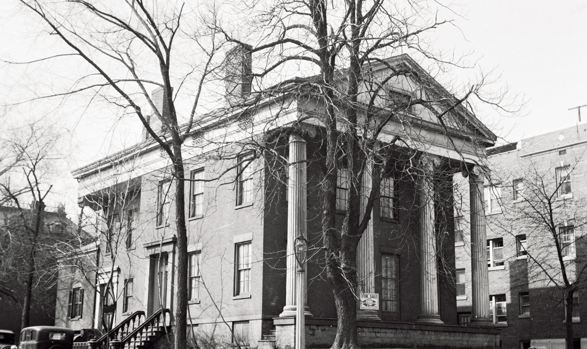 Campbell-Whittlesey house featuring columns, exterior cornice mouldings, window mouldings and casings, and staircase to door.