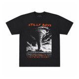Stilly Boys Sleep When the Wind Blows t-shirt in washed black with illustrated tornado over an Oklahoma farmhouse and windmill, orange lettering — Stillwater, Oklahoma wrestling lifestyle apparel