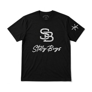Black Stilly Boys brand tee with interlocking SB monogram in distressed white on the chest, script Stilly Boys wordmark beneath it, and a barbed star mark on the right sleeve.