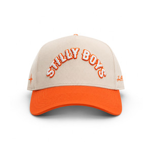 Stilly Boys Orange Hat snapback in natural cream with orange bill, white 3D embroidered arched lettering with orange outline and stitched star detail — Stillwater, Oklahoma wrestling lifestyle apparel