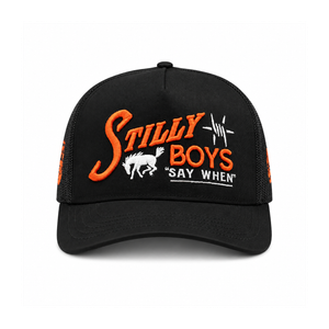 Stilly Boys Relentless trucker hat in black with orange script embroidery, white bucking bronc, barbed star, and Say When stitching — Stillwater, Oklahoma wrestling lifestyle apparel