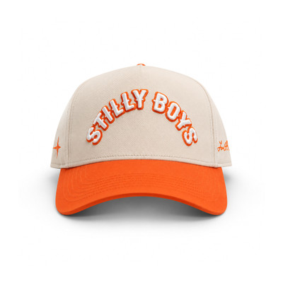 Stilly Boys Orange Hat snapback in natural cream with orange bill, white 3D embroidered arched lettering with orange outline and stitched star detail — Stillwater, Oklahoma wrestling lifestyle apparel