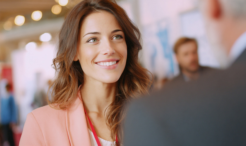 female engaging vendor at job fair for new career