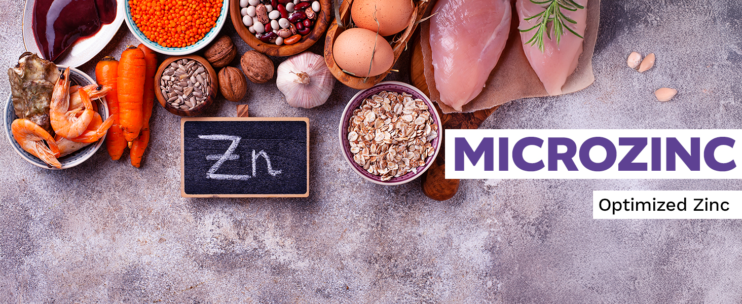 Various zinc-rich foods including shrimp, chicken, eggs, nuts, seeds, lentils, and oats arranged around a chalkboard with Zn written on it, alongside text reading MICROZINC Optimized Zinc.