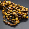 High Quality Grade A Natural Tiger Eye Semi-precious Gemstone Pebble Tumbledstone Nugget Beads - approx 5mm - 8mm - 15" long strand