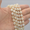 Grade A Natural White Moonstone Semi-precious Gemstone Double Tip FACETED Round Beads - 7mm x 8mm - 15" strand