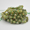 Grade A Natural Green Garnet Semi-precious Gemstone Double Tip FACETED Round Beads - 5mm x 6mm - 15" strand Grade A Natural Green Garnet Semi-precious Gemstone Double Tip FACETED Round Beads - 5mm x 6mm - 15" strand