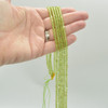 High Quality Grade A Natural Peridot Semi-precious Gemstone FACETED Lantern style Round Beads - 4mm - 15" strand