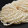 Natural Freshwater Rice Pearl Beads - Off White - approx 6mm - 7mm x 4mm - approx 14'' Strand