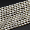 Natural Freshwater Rice Pearl Beads - Off White - approx 6mm - 7mm x 4mm - approx 14'' Strand