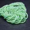 Cubic Zirconia FACETED Round Beads - Bright Green - 2mm - 15'' Strand