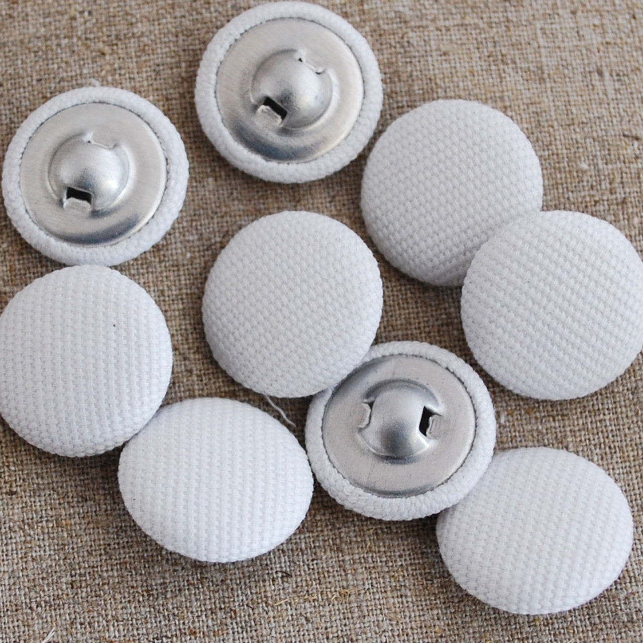 white fabric buttons