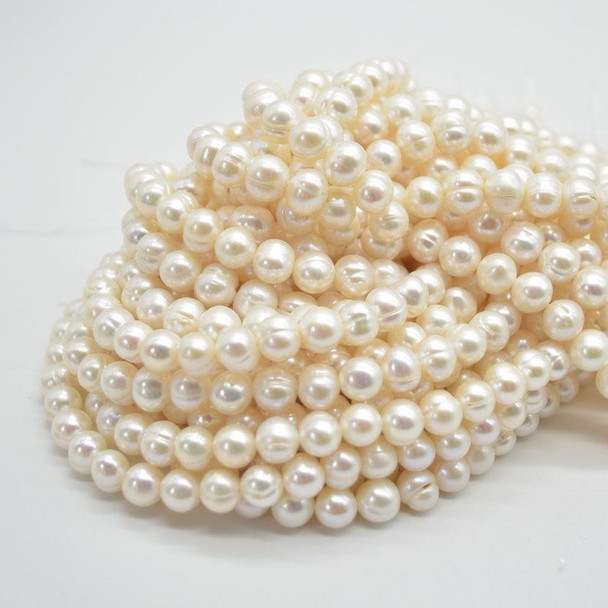 Grade B Freshwater Near Round Pearl Beads - approx 8mm - 9mm - 14" strand