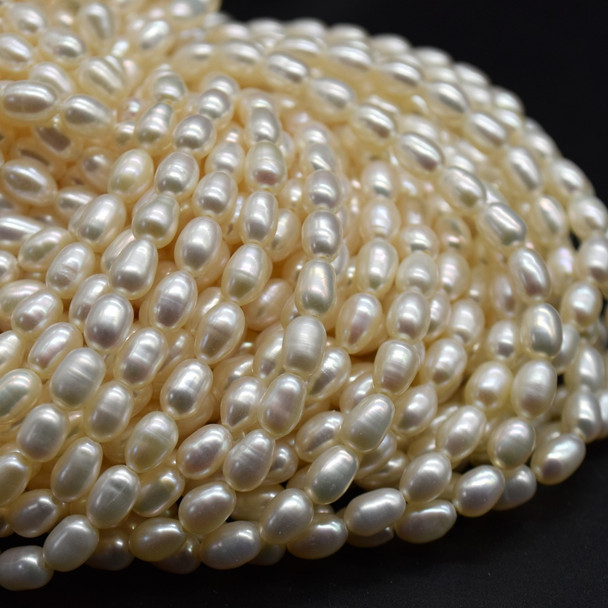 Natural Freshwater Rice Pearl Beads - Off White - approx 6mm - 7mm x 4mm - approx 14'' Strand