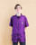 An image of a person wearing the purple Hydra Unisex Cut Smock