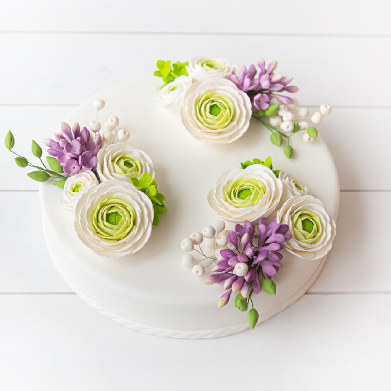 Example of a Cake you can create using the white floral bud spray with the additional of other floral pieces.