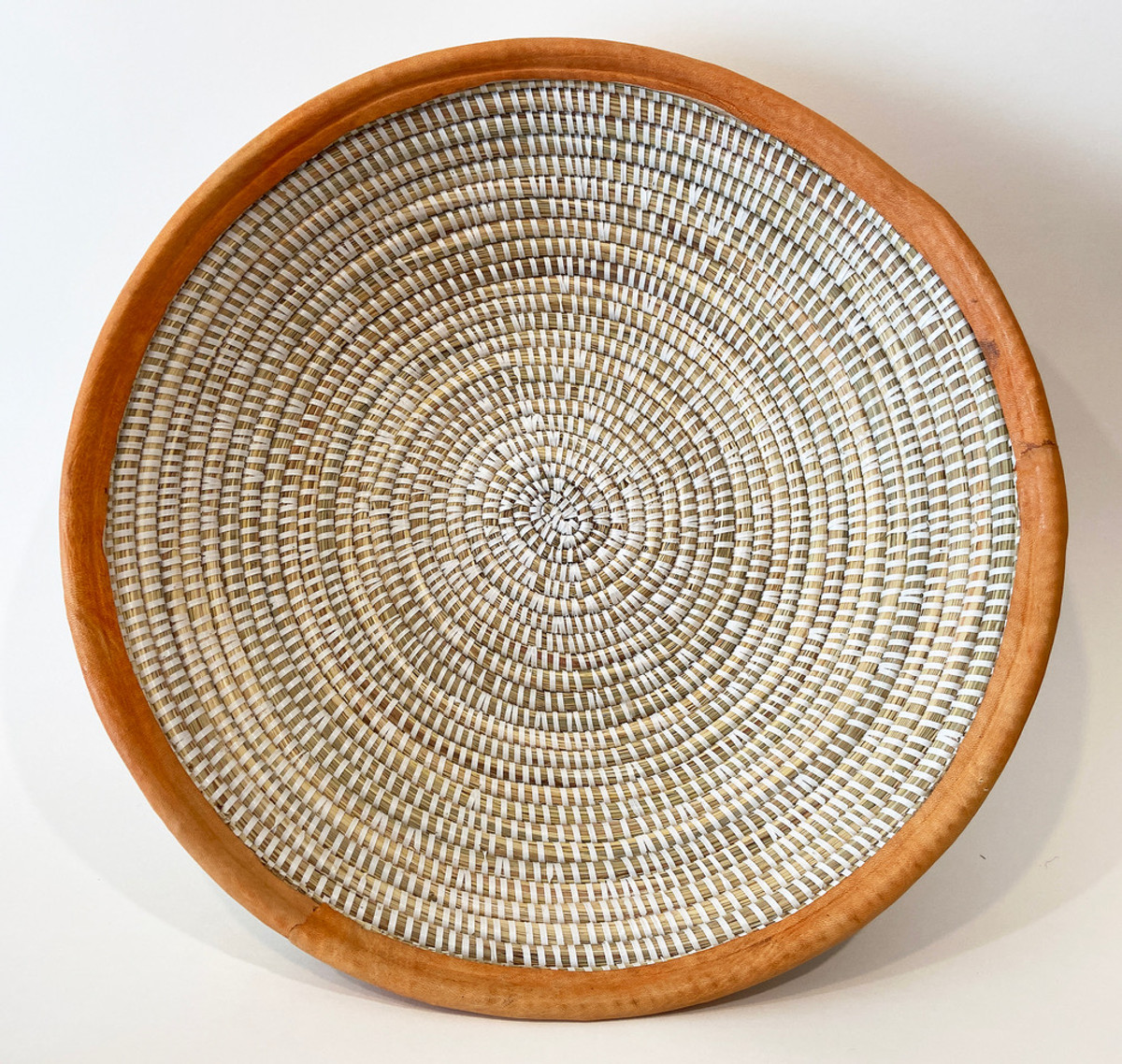 Handwoven Grass Basket Senegal (16" across) grasses, and strips of white recycled prayer mats and chalky saffron colored leather trim.