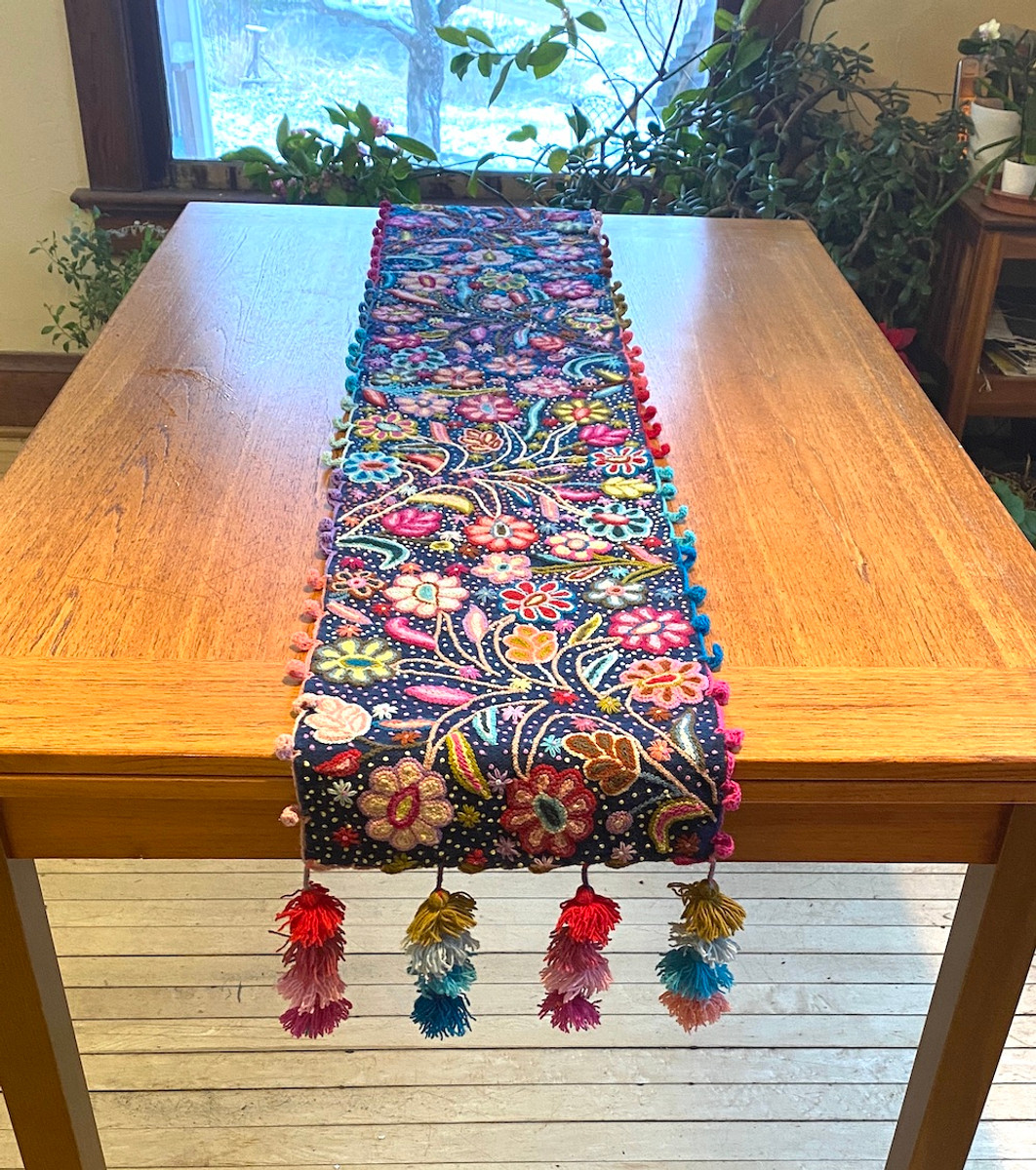 Handwoven Hand Embroidered Wool Table Runner Navy Blue Peru.  The floral patterns are done using different embroidery and crewel stitches.  Some of the colors: red, pink, turquoise, light blue, yelLow,  olive, lime green, fuchsia, red brown, lavender,, salmon, and more.