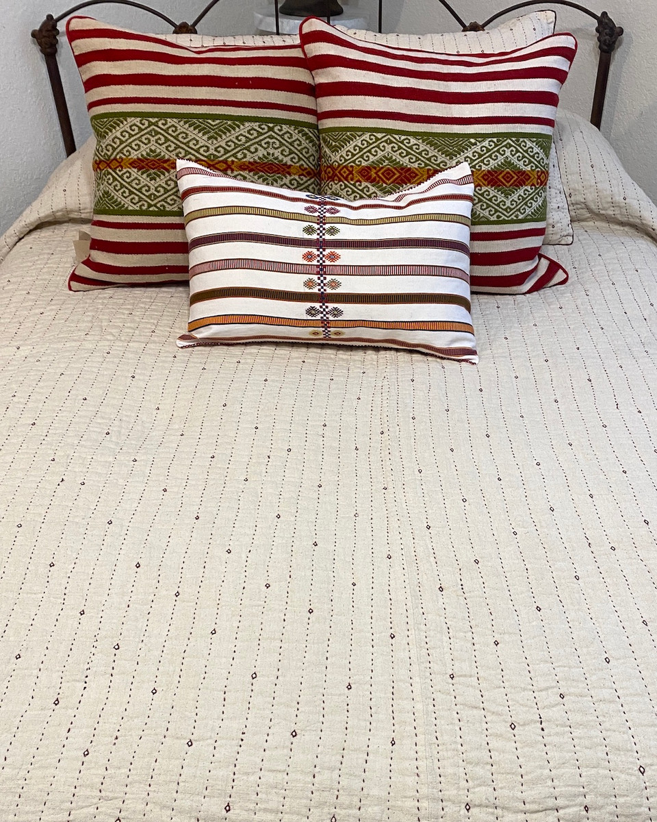 Handwoven Organic Cotton Hand Stitched Queen Quilt India. Handwoven organic kala quilt. This off-white quilt is the natural cotton color. There are rows of deep red hand stitching one inch apart, with small diamonds on the front side.