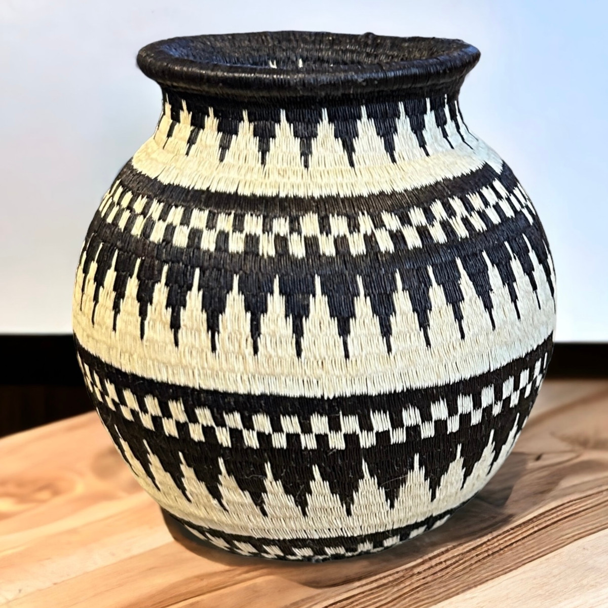 This small small fine basket is made from natural palm fronds cut into fine strips. The sturdy basket is woven with a complex technique and with a fine tight pattern. The Wounaan women are considered the finest basket makers in the world. Through basketry they help preserve their culture and in so doing they respect the earth with sustainable harvesting practices. Colors: cream and black.