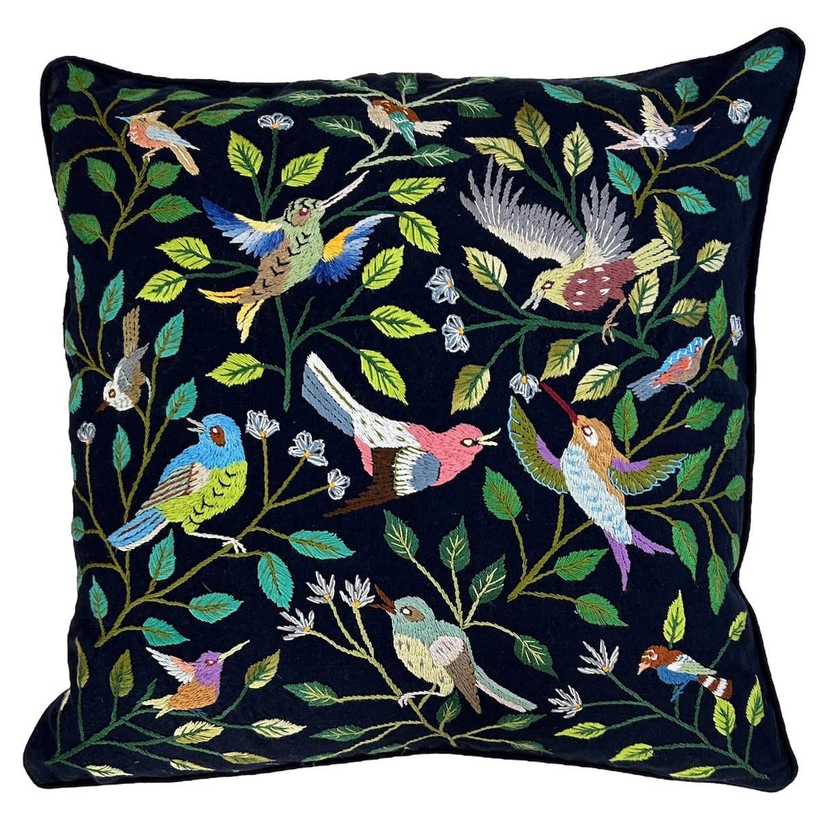 Handwoven cotton pillow with hand embroidery by Maria, one of the talented embroidery artists of Santiago Atitlan. The detailed embroidery is birds with branches, leaves and flowers on a deep indigo blue handwoven cotton cloth. The back is the same handwoven cloth. Rolled piping is linen. Colors of embroidery- greens, blues, pink, grey, violet, white, tobacco and more.  Hidden zipper with 90-10 feather/down pillow insert. Read more about the embroidery artists here.
