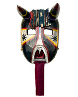 Hand carved and painted bull mask.Colors: black, off-white, red yellow, lavender and a little of light blue.