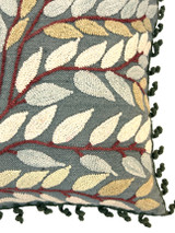 detail Beautiful hand woven woolen pillow. The leaf design is fine crewel embroidery in wool yarn. Colors of designs: cream, pale aqua, wheat and red brown. The front and back are smoky grey blue wool cloth. The edges are adorned with wool crocheted spirals in evergreen. 