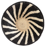 top view. Handwoven medium size fiber basket made with natural sisal from sustainably harvested sources. This is from a small artisan organization that has been working in Eswatini (Swaziland) since 1985. Very sturdy. Beautiful on the table or on the wall. Colors: black and creamy white.