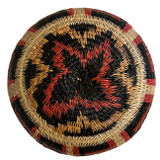 bottom view This small small fine basket is made from natural palm fronds cut into fine strips. The sturdy basket is woven with a complex technique and with a fine tight pattern. The Wounaan women are considered the finest basket makers in the world. Through basketry they help preserve their culture and in so doing they respect the earth with sustainable harvesting practices. Colors:red, beige, camel and black.