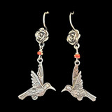 Handmade sterling earrings by a talented family of silversmiths in Peru. Silver bird and flower. Coral colored bead. We purchased these directly from this family. We love their work! 