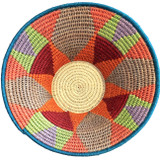 top view Handwoven medium size fiber basket made with natural sisal from sustainably harvested sources. This is from a small artisan organization that has been working in Eswatini (Swaziland) since 1985. Very sturdy. Beautiful on the table or on the wall. Colors:papaya, lime green, deep red, cocoa, lavender and cream.

