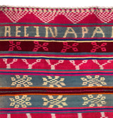 detail Our new collection of vintage hand woven wool frazadas are stunning! Hand woven in two panels from the mountains of Peru used by the Aymara or Quechua people that live in the high Andes. This is a special one with the resist dyed patterns and words. The words are probably the weaver's name. This is a heavier throw but beautiful draped on the couch or the foot of the bed. This would also be beautiful on the wall. Vintage condition with some minor spots or discolorations. 100% wool. Colors: hot pink, bright deep burgundy, greyish blue, red, light wheat, burnt orange, royal blue and light yellow. There is a soft white to lavender colored crocheted edge around the whole blanket.
