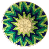 Handwoven medium size fiber basket made with natural sisal from sustainably harvested sources. This is from a small artisan organization that has been working in Eswatini (Swaziland) since 1985. Very sturdy. Beautiful on the table or on the wall. Colors: lime green, kelly green, deep royal blue and cream.