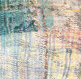 detail Hand stitched cotton pillow. We purchased this quilt from India and then took it to Guatemala where the women of UPAVIM made it into a pillow.  The front is several layers thick and worn through giving a beautiful patina. The pillow has fine rows of stitching that secures  the fabric layers and giving a nice texture. Colors: a painterly range of pale turquoise, light blue, soft yellow, muted red brown, forest green, off-white, palepinkish lilac, papaya and more.. The back and hand rolled piping are a pale sage colored mixed fiber cloth. 90/10 feather/down pillow insert. Hidden zipper. 