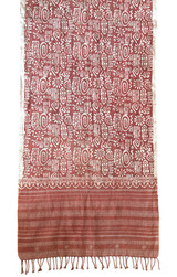 half view Beautiful handwoven batik shawl. We bought this from Shakil Khatri, a 10th generation of batik block printers in Mundra, Gujarat. We were fortunate to be able to watch this complex batik process while visiting his studio. This is a medium weight handwoven cotton with a 10" subtle woven pattern at each end. Colors: terra cotta and creamy white.  The woven pattern color is a light pinkish terra cotta. The batik process gives a crackle pattern in parts and the block printed designs have soft edges. Natural indigo dyed. This can be worn as a large scarf and would also make a beautiful curtain.

